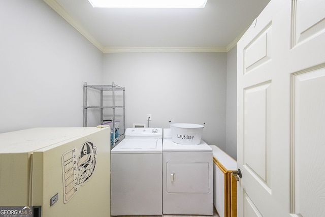 750 Old Loganville Rd SW, Loganville, GA 30052 - laundry area featuring washer and clothes dryer and crown molding