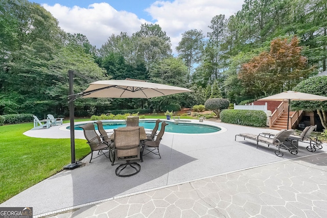 750 Old Loganville Rd SW, Loganville, GA 30052 - swimming pool featuring a patio area, a lawn, and view of scattered trees