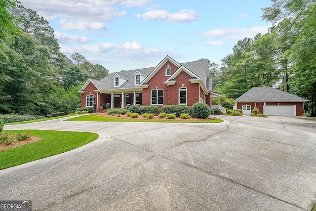 750 Old Loganville Rd SW, Loganville, GA 30052 - view of front of house with brick siding, an outdoor structure, and a front yard