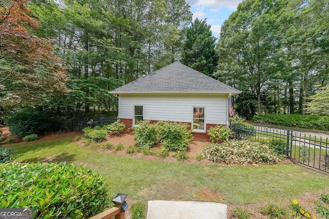 750 Old Loganville Rd SW, Loganville, GA 30052 - view of side of home featuring brick siding and roof with shingles