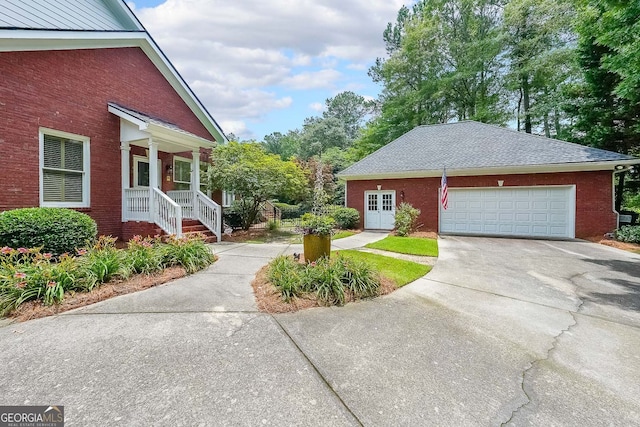 750 Old Loganville Rd SW, Loganville, GA 30052 - view of side of home with driveway, brick siding, and roof with shingles