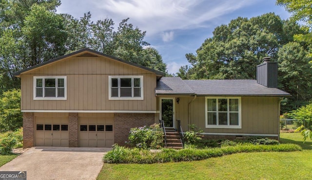 70 Plymouth Ln, Carrollton, GA 30117 - tri-level home with brick siding, a chimney, a garage, and driveway