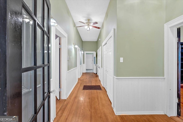 226 Noyes St, Cedartown, GA 30125 - hallway with wainscoting and wood finished floors