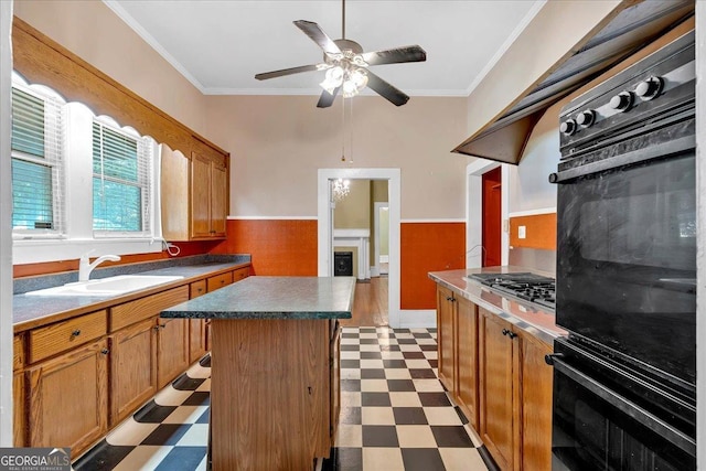 226 Noyes St, Cedartown, GA 30125 - kitchen featuring black oven, light floors, stainless steel gas stovetop, crown molding, and a ceiling fan