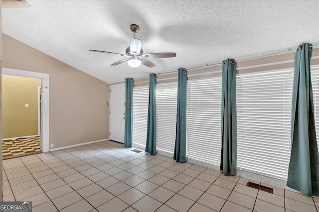 226 Noyes St, Cedartown, GA 30125 - empty room featuring vaulted ceiling, ceiling fan, a textured ceiling, and light tile patterned floors