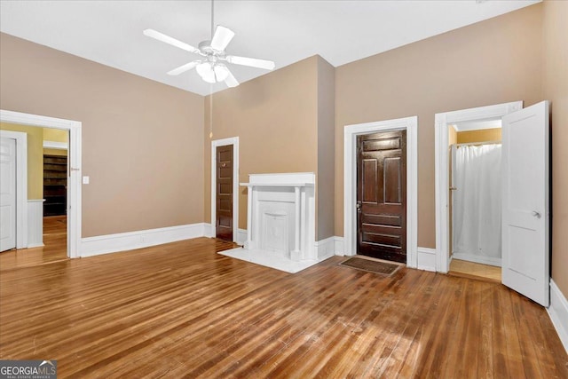 226 Noyes St, Cedartown, GA 30125 - unfurnished living room featuring wood finished floors, a ceiling fan, and vaulted ceiling