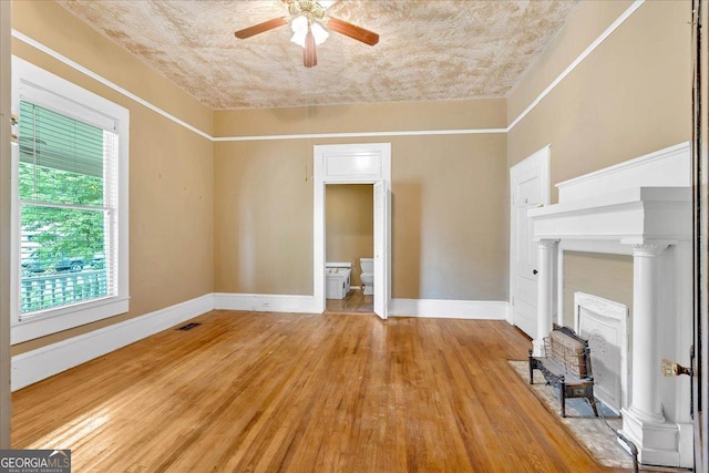 226 Noyes St, Cedartown, GA 30125 - unfurnished living room featuring a ceiling fan and light wood-style flooring