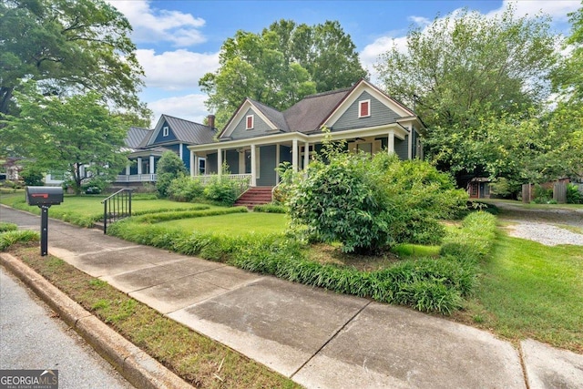226 Noyes St, Cedartown, GA 30125 - craftsman-style house featuring a porch, a front lawn, and a metal roof