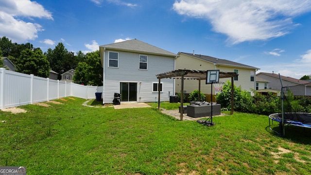 400 Silver Spring St, Dallas, GA 30157 - rear view of house with a trampoline, a pergola, a patio area, an outdoor living space, and a fenced backyard