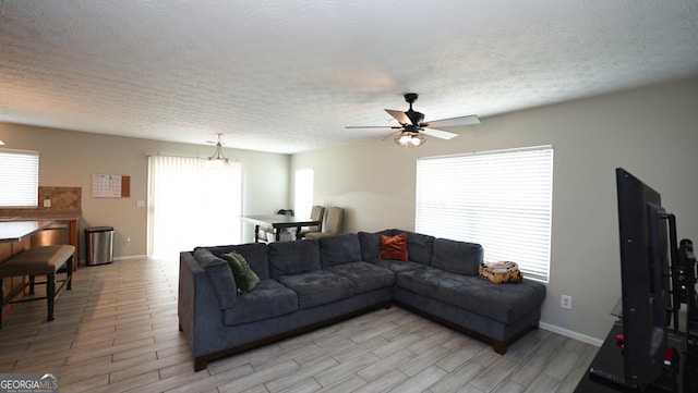 400 Silver Spring St, Dallas, GA 30157 - living area with ceiling fan, light wood-style flooring, and a textured ceiling