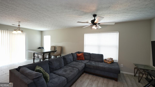 400 Silver Spring St, Dallas, GA 30157 - living area featuring light wood-style floors, ceiling fan, and a chandelier