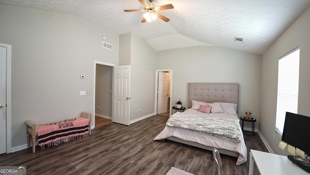 400 Silver Spring St, Dallas, GA 30157 - bedroom with lofted ceiling, dark wood-style flooring, a textured ceiling, and a ceiling fan
