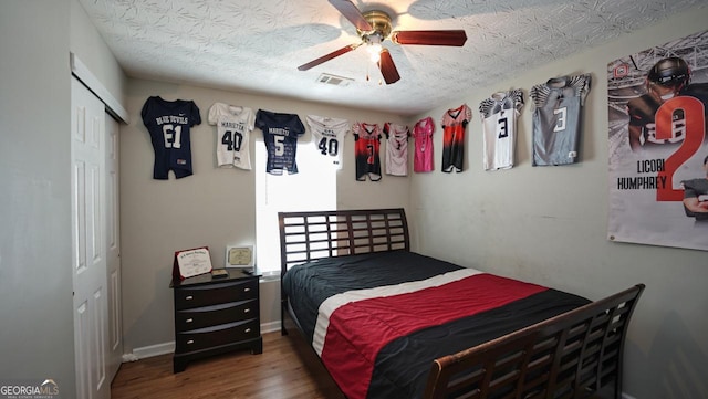 400 Silver Spring St, Dallas, GA 30157 - bedroom featuring wood finished floors, a closet, and a ceiling fan