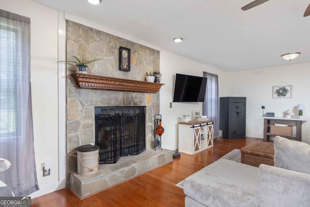 1101 Moon Rd, Shiloh, GA 31826 - living area with a stone fireplace, wood finished floors, and ceiling fan