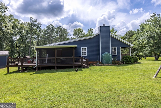 1101 Moon Rd, Shiloh, GA 31826 - back of property featuring a sunroom, a chimney, a lawn, and a wooden deck