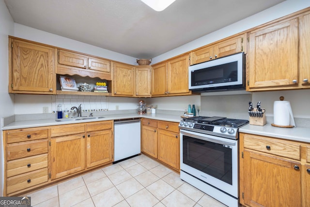1101 Moon Rd, Shiloh, GA 31826 - kitchen with appliances with stainless steel finishes, light countertops, light tile patterned floors, and open shelves