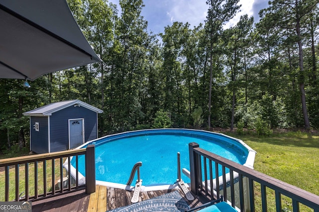 1101 Moon Rd, Shiloh, GA 31826 - outdoor pool with a yard, a wooden deck, a shed, and view of wooded area