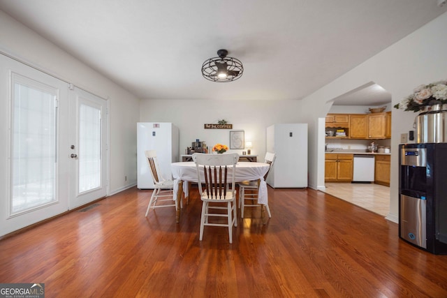 1101 Moon Rd, Shiloh, GA 31826 - dining space featuring wood finished floors, french doors, and arched walkways