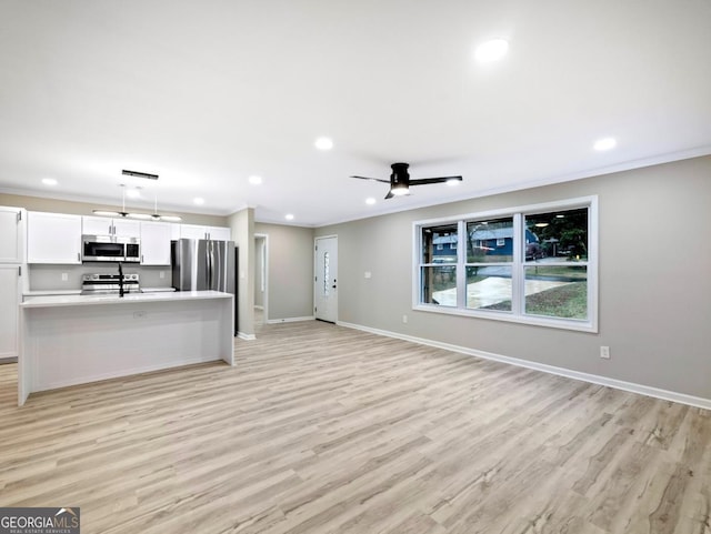 2308 Mark Trl, Decatur, GA 30032 - unfurnished living room featuring light wood-type flooring, recessed lighting, crown molding, and a ceiling fan