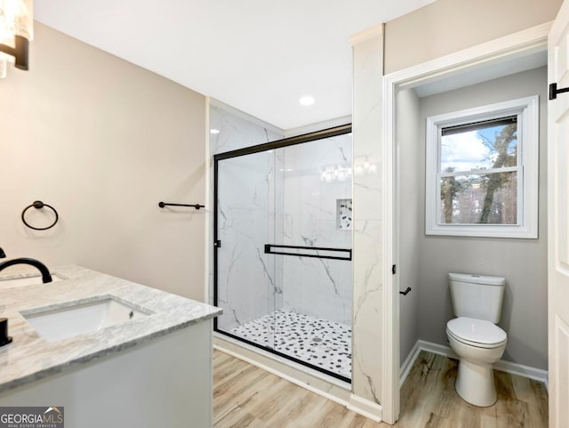 2308 Mark Trl, Decatur, GA 30032 - full bathroom with a marble finish shower, wood finished floors, double vanity, and recessed lighting