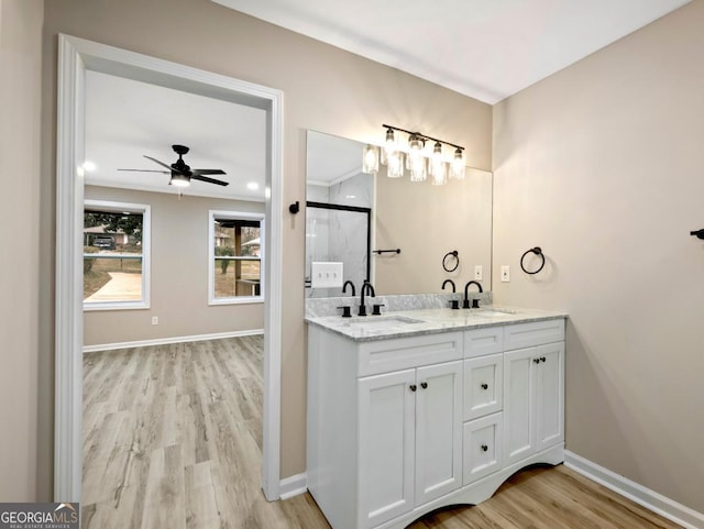 2308 Mark Trl, Decatur, GA 30032 - full bath with wood finished floors, double vanity, a ceiling fan, and a shower with shower door