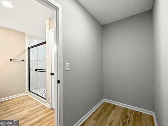 2308 Mark Trl, Decatur, GA 30032 - bathroom with wood finished floors, a marble finish shower, and recessed lighting
