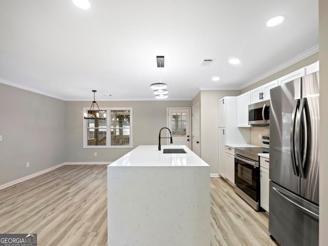 2308 Mark Trl, Decatur, GA 30032 - kitchen featuring stainless steel appliances, light wood finished floors, white cabinetry, ornamental molding, and pendant lighting