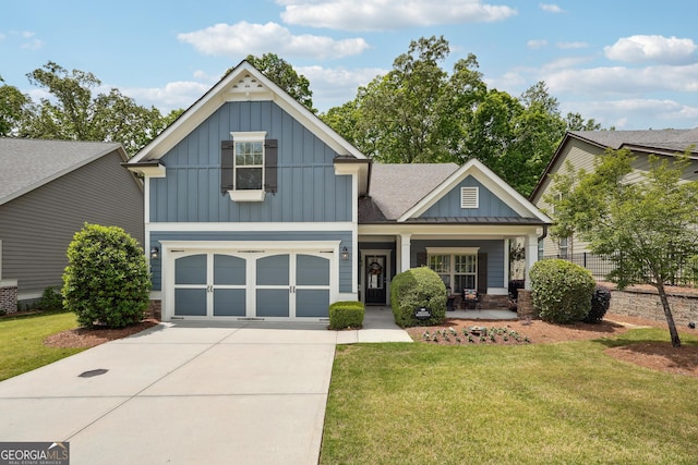 6722 Blue Heron Way, Flowery Branch, GA 30542 - view of front of house with board and batten siding, concrete driveway, a front yard, and an attached garage