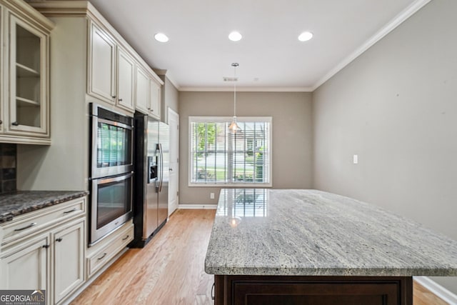 6722 Blue Heron Way, Flowery Branch, GA 30542 - kitchen with appliances with stainless steel finishes, light wood-style floors, recessed lighting, light stone counters, and a center island