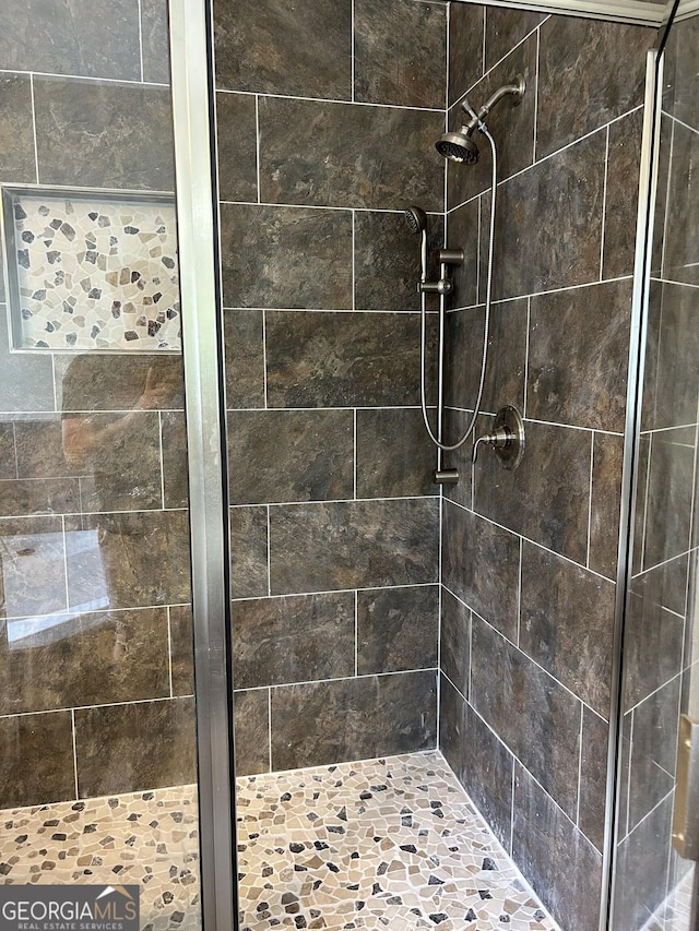 6722 Blue Heron Way, Flowery Branch, GA 30542 - bathroom featuring a stall shower