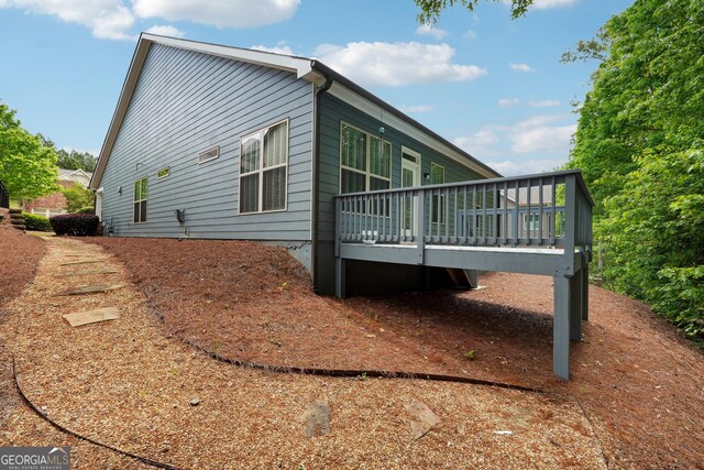 6722 Blue Heron Way, Flowery Branch, GA 30542 - view of side of property with a wooden deck