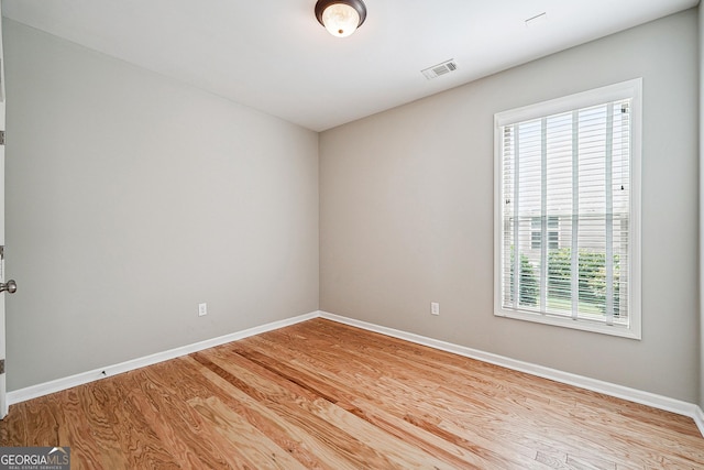 6722 Blue Heron Way, Flowery Branch, GA 30542 - unfurnished room featuring baseboards and wood finished floors