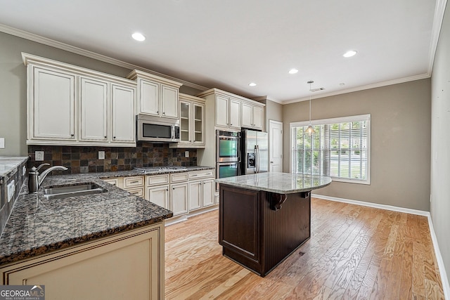 6722 Blue Heron Way, Flowery Branch, GA 30542 - kitchen with stainless steel appliances, tasteful backsplash, recessed lighting, light wood-style flooring, and ornamental molding