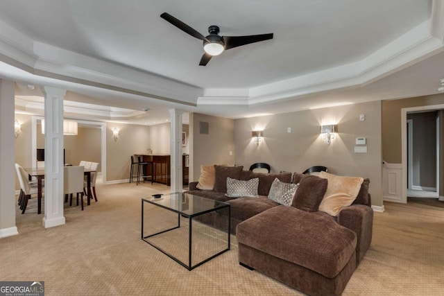 2375 Hyde Park Ct NW, Atlanta, GA 30318 - living area with a raised ceiling, light carpet, ceiling fan, and ornate columns