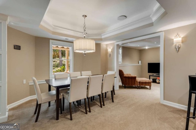2375 Hyde Park Ct NW, Atlanta, GA 30318 - dining room featuring crown molding, a raised ceiling, and light carpet