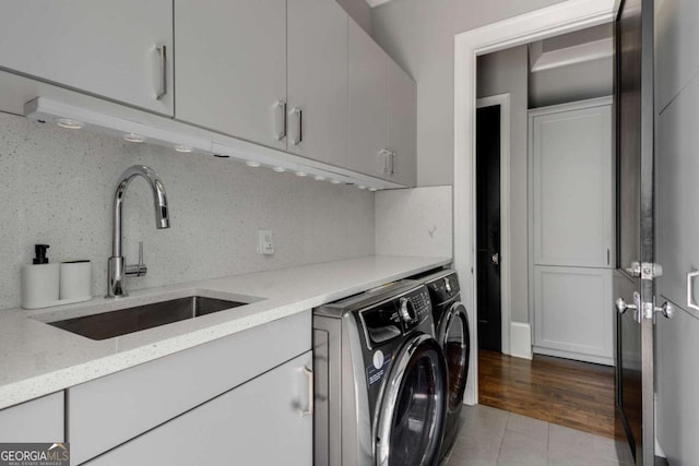 2375 Hyde Park Ct NW, Atlanta, GA 30318 - laundry room with cabinet space, washer and dryer, and tile patterned flooring