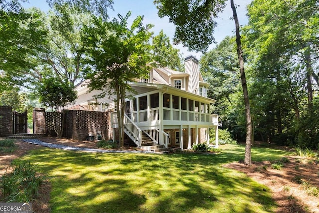 2375 Hyde Park Ct NW, Atlanta, GA 30318 - back of house with a sunroom, a gate, a lawn, a chimney, and stairway