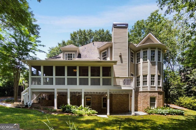 2375 Hyde Park Ct NW, Atlanta, GA 30318 - back of house featuring a chimney, a sunroom, a yard, brick siding, and stairway