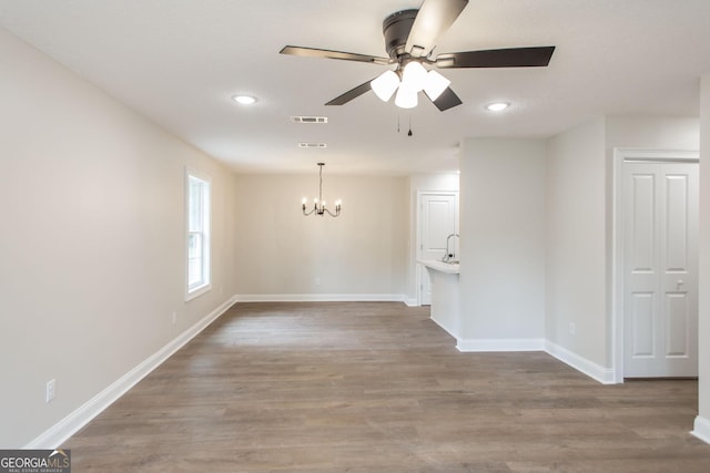 1920 Darling Ave, Waycross, GA 31501 - empty room featuring a chandelier, a ceiling fan, wood finished floors, and recessed lighting