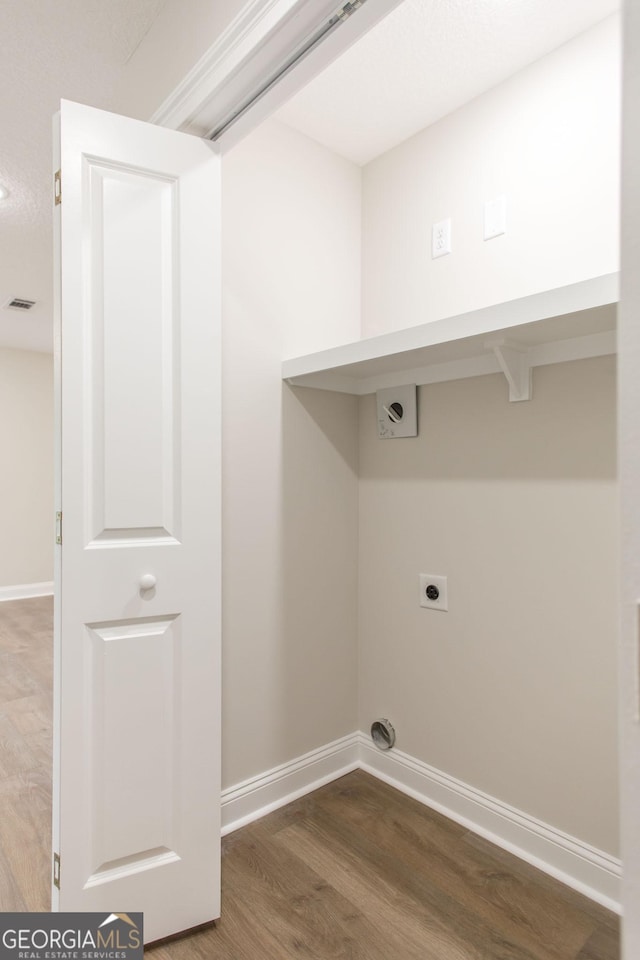 1920 Darling Ave, Waycross, GA 31501 - laundry area with hookup for an electric dryer and wood finished floors