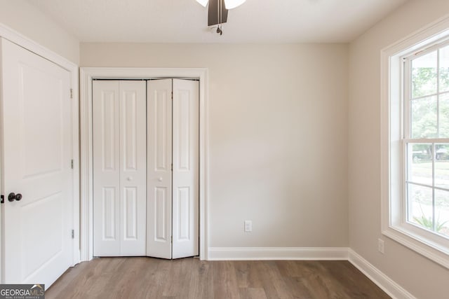 1920 Darling Ave, Waycross, GA 31501 - unfurnished bedroom with wood finished floors, a closet, and ceiling fan