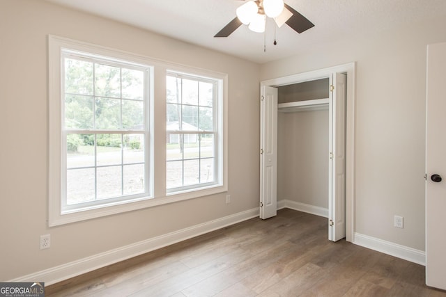 1920 Darling Ave, Waycross, GA 31501 - unfurnished bedroom with wood finished floors, a closet, and ceiling fan