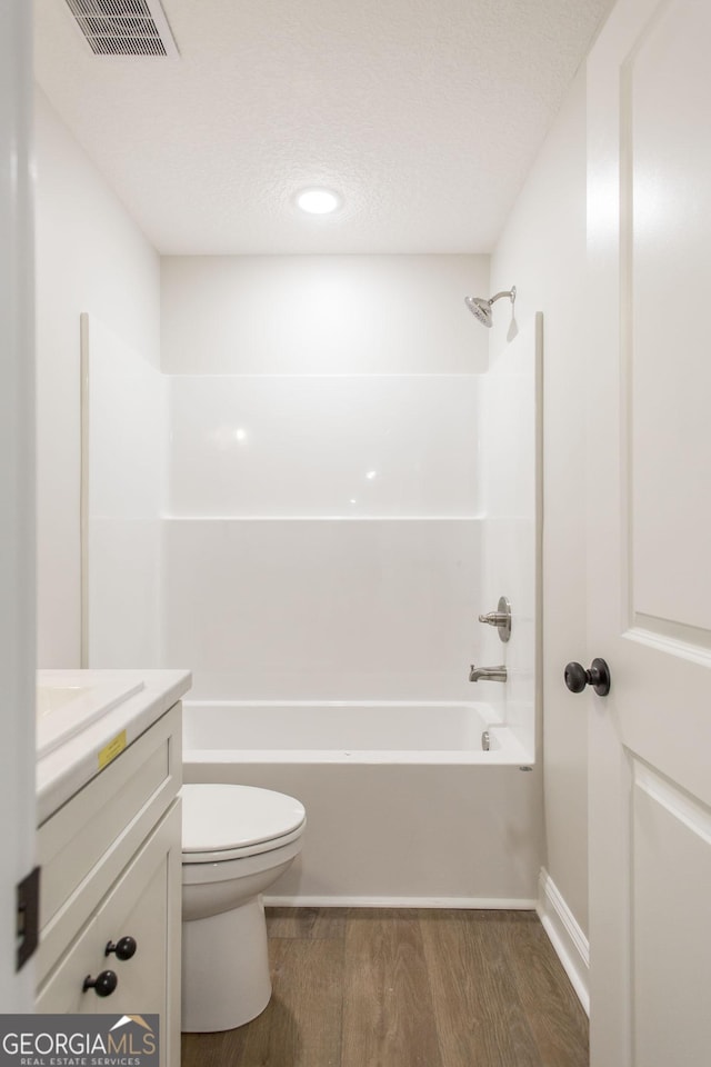 1920 Darling Ave, Waycross, GA 31501 - bathroom with wood finished floors, vanity, and shower / bathtub combination