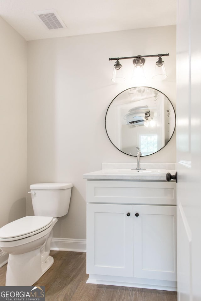 1920 Darling Ave, Waycross, GA 31501 - half bathroom featuring wood finished floors and vanity