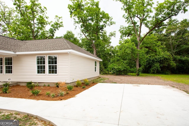 1920 Darling Ave, Waycross, GA 31501 - view of side of property featuring roof with shingles and a patio area