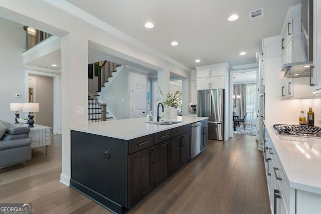 510 Walden Glen Ln, Alpharetta, GA 30004 - kitchen with appliances with stainless steel finishes, white cabinets, dark wood-style floors, light countertops, and recessed lighting