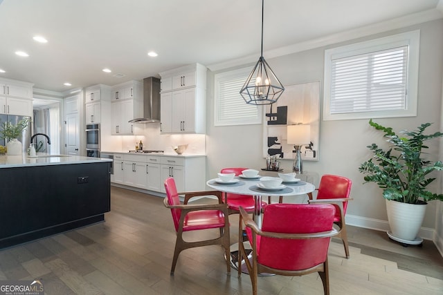 510 Walden Glen Ln, Alpharetta, GA 30004 - dining area with wood-type flooring, recessed lighting, ornamental molding, and a chandelier