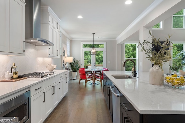 510 Walden Glen Ln, Alpharetta, GA 30004 - kitchen with wall chimney range hood, stainless steel appliances, plenty of natural light, white cabinets, and recessed lighting