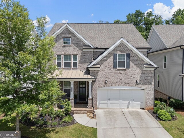 510 Walden Glen Ln, Alpharetta, GA 30004 - craftsman-style house featuring brick siding, driveway, a garage, covered porch, and a shingled roof