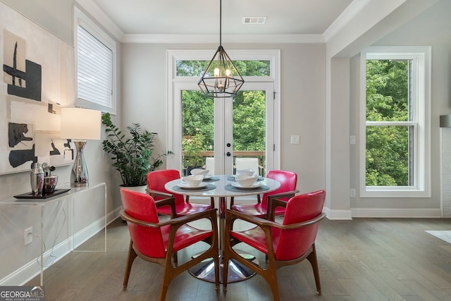 510 Walden Glen Ln, Alpharetta, GA 30004 - dining space with wood finished floors, healthy amount of natural light, crown molding, a chandelier, and french doors